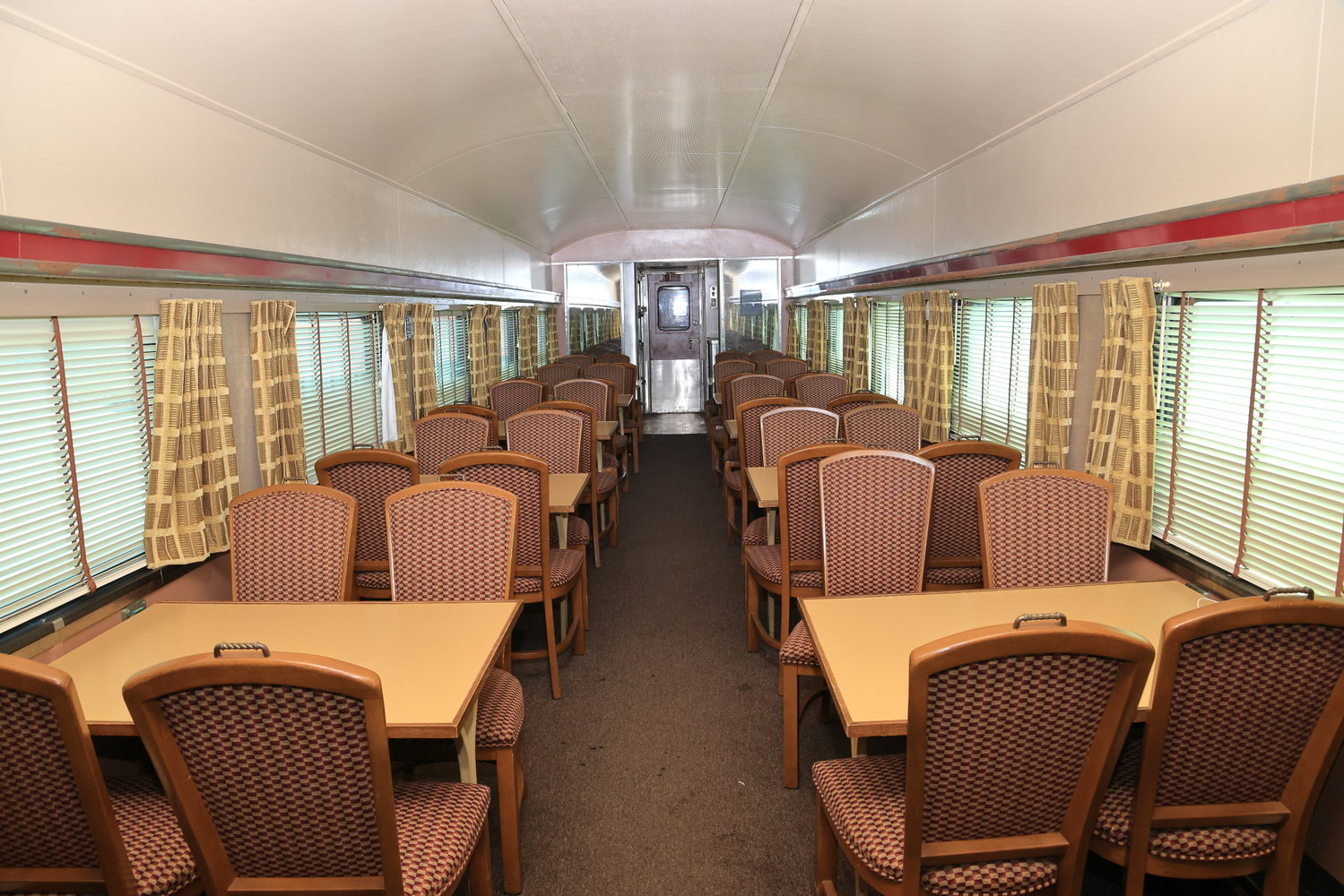 Pictured is the beautifully restored 48-seat dining area of dining car 469, originally built in 1949 for the Lackawanna Railroad. The exterior will be restored to its authentic Lackawanna appearance, thanks to a generous grant. It is used for stationary meal service on-site in Port..Jervis, as well as for off-site events like Operation Toy Train’s annual Toys for Tots collection train.